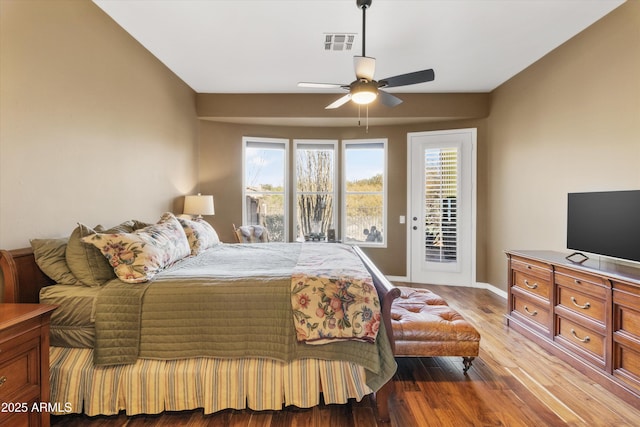 bedroom featuring multiple windows, light wood-type flooring, access to outside, and ceiling fan