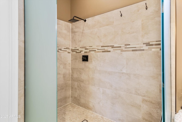 bathroom with tiled shower