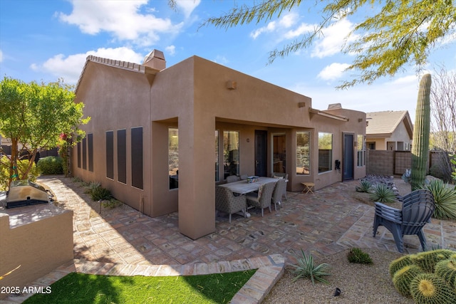 rear view of house with a patio