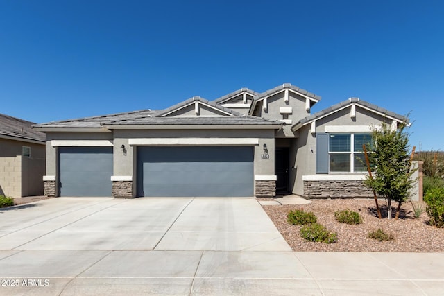 1370 W Siboney St, San Tan Valley, AZ 85143 - view of front facade with stucco siding, driveway, an attached garage, and stone siding