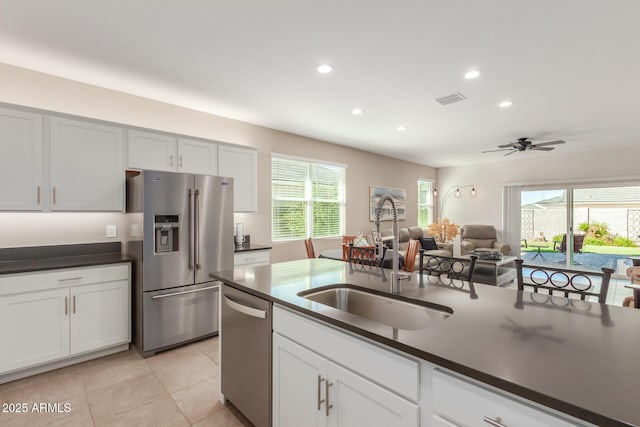 1370 W Siboney St, San Tan Valley, AZ 85143 - kitchen featuring a sink, stainless steel appliances, a wealth of natural light, visible vents, and dark countertops