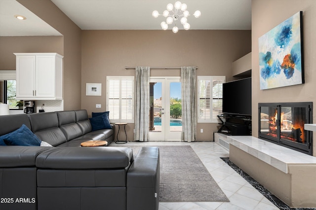 8601 E De La O Rd, Scottsdale, AZ 85255 - living room with plenty of natural light, a glass covered fireplace, light tile patterned floors, recessed lighting, and a chandelier