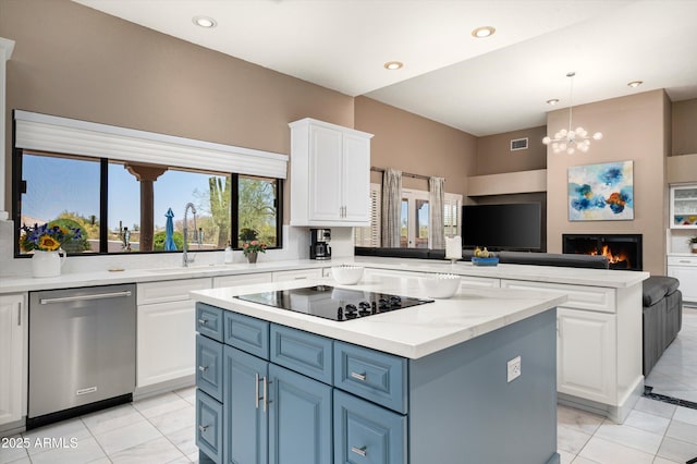 8601 E De La O Rd, Scottsdale, AZ 85255 - kitchen with dishwasher, black electric cooktop, a kitchen island, a sink, and a peninsula