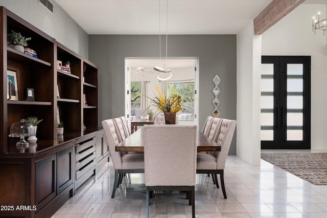 8601 E De La O Rd, Scottsdale, AZ 85255 - dining space featuring a chandelier and light tile patterned floors