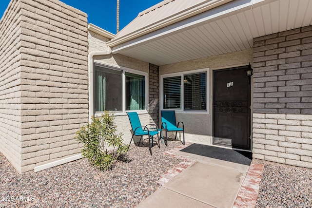 doorway to property featuring a patio