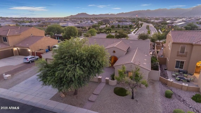 birds eye view of property with a mountain view