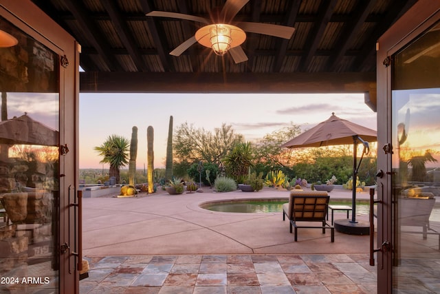 patio terrace at dusk with ceiling fan