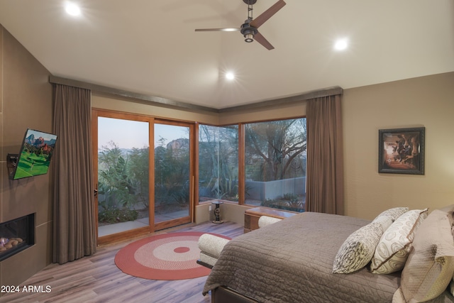 bedroom featuring ceiling fan and light hardwood / wood-style flooring