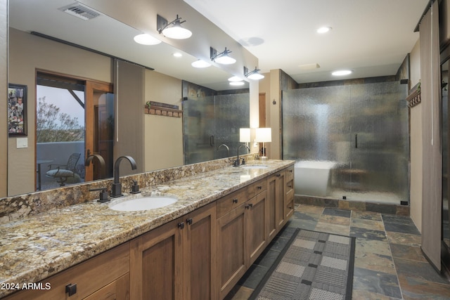 bathroom with vanity and walk in shower