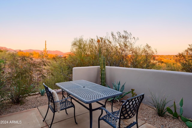 view of patio terrace at dusk