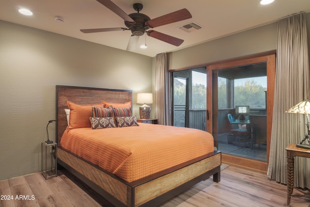 bedroom featuring ceiling fan, light hardwood / wood-style floors, and access to outside