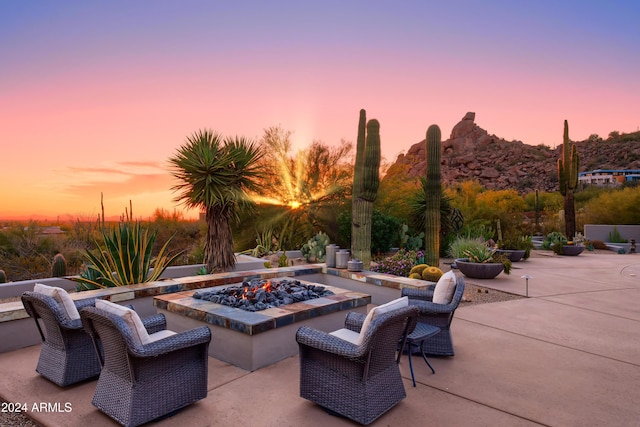 patio terrace at dusk with an outdoor fire pit