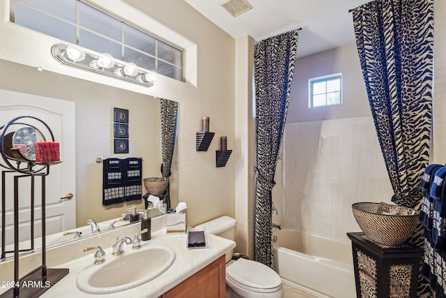 full bathroom with vanity, toilet, and shower / bathtub combination with curtain