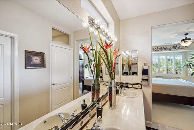 bathroom with ceiling fan and vanity