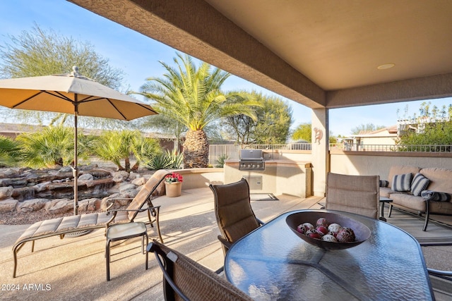 view of patio featuring a grill and exterior kitchen