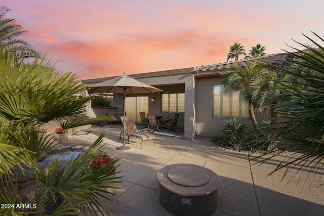 view of patio terrace at dusk