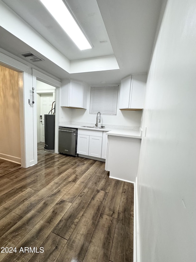 kitchen with dark hardwood / wood-style flooring, white cabinetry, dishwasher, and sink