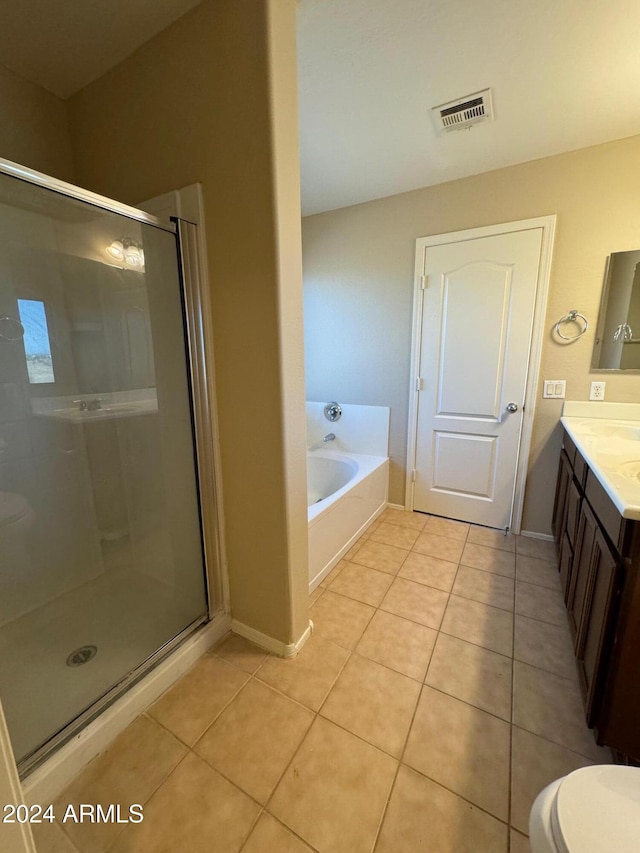 full bathroom with tile patterned floors, vanity, toilet, and plus walk in shower