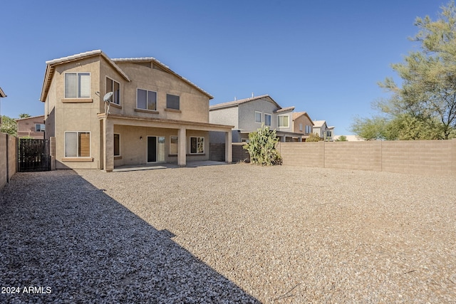 back of property featuring a patio