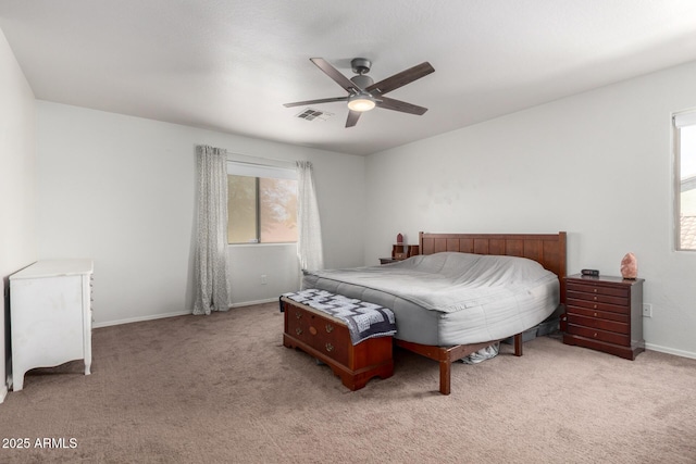 bedroom featuring visible vents, multiple windows, and carpet flooring