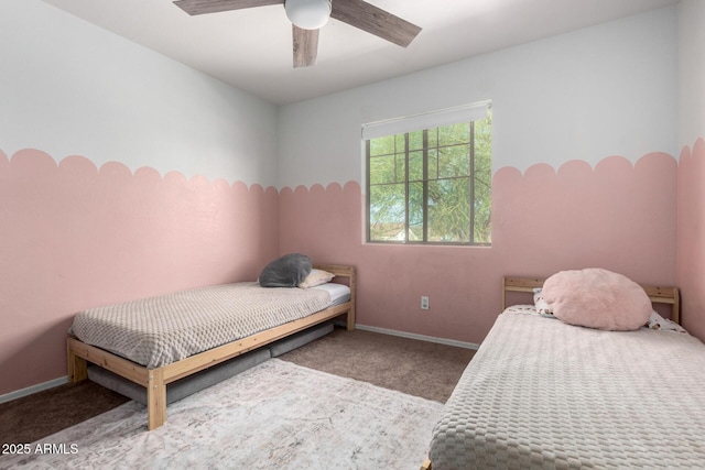 bedroom featuring baseboards, carpet floors, and ceiling fan