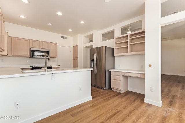 kitchen with visible vents, appliances with stainless steel finishes, light wood-type flooring, built in study area, and recessed lighting