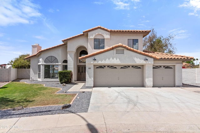 3520 N 110th Ave, Avondale, AZ 85392 - mediterranean / spanish-style house featuring a tile roof, concrete driveway, a garage, and stucco siding