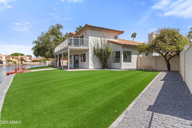3520 N 110th Ave, Avondale, AZ 85392 - back of property with a tile roof, a patio area, stucco siding, a fenced backyard, and a yard