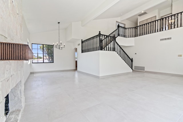 3520 N 110th Ave, Avondale, AZ 85392 - unfurnished living room featuring visible vents, baseboards, stairway, beam ceiling, and an inviting chandelier