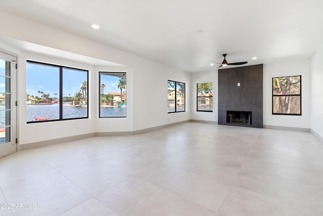 3520 N 110th Ave, Avondale, AZ 85392 - unfurnished living room featuring baseboards, a fireplace, ceiling fan, and recessed lighting