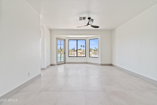 3520 N 110th Ave, Avondale, AZ 85392 - spare room with baseboards, visible vents, and a ceiling fan
