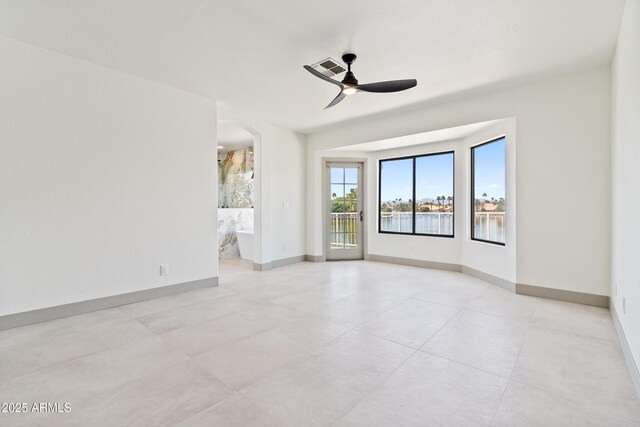 3520 N 110th Ave, Avondale, AZ 85392 - empty room with a ceiling fan, arched walkways, baseboards, and visible vents