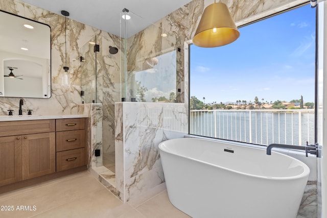 3520 N 110th Ave, Avondale, AZ 85392 - full bath featuring tile walls, a soaking tub, a marble finish shower, a ceiling fan, and vanity