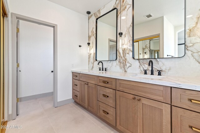 3520 N 110th Ave, Avondale, AZ 85392 - bathroom with backsplash, double vanity, a sink, and visible vents