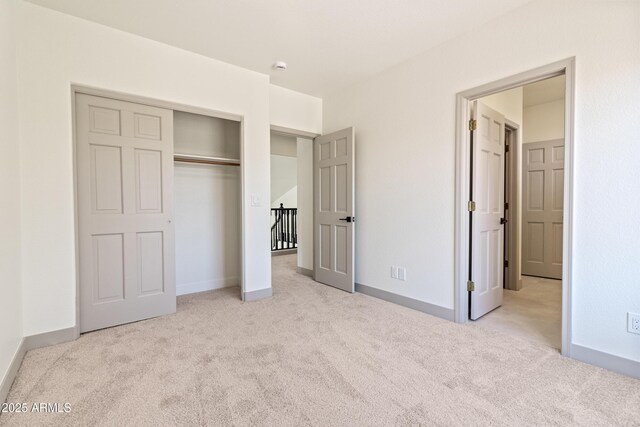 3520 N 110th Ave, Avondale, AZ 85392 - unfurnished bedroom with baseboards, a closet, and carpet flooring