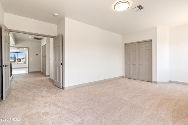 3520 N 110th Ave, Avondale, AZ 85392 - unfurnished bedroom with light colored carpet, visible vents, a closet, and baseboards