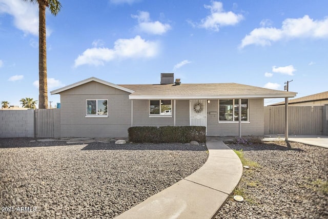 ranch-style house featuring central air condition unit and fence