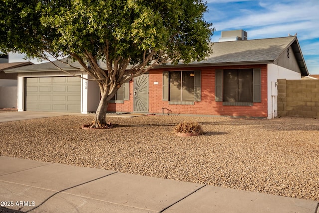 single story home featuring a garage