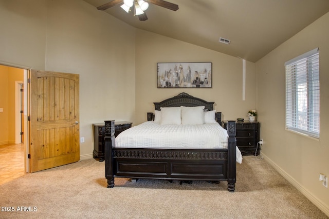 bedroom featuring light carpet, vaulted ceiling, and ceiling fan