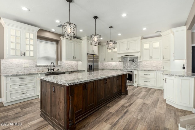 1051 E Julie Ave, San Tan Valley, AZ 85140 - kitchen featuring appliances with stainless steel finishes, a sink, and white cabinetry