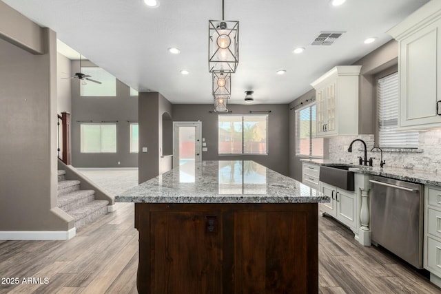 1051 E Julie Ave, San Tan Valley, AZ 85140 - kitchen with a ceiling fan, light wood-style floors, visible vents, dishwasher, and a sink