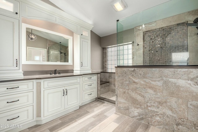 1051 E Julie Ave, San Tan Valley, AZ 85140 - full bathroom featuring a walk in shower, vanity, and wood finished floors