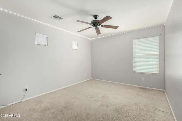 1051 E Julie Ave, San Tan Valley, AZ 85140 - spare room with ceiling fan, baseboards, visible vents, and carpet floors