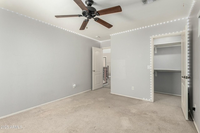 1051 E Julie Ave, San Tan Valley, AZ 85140 - unfurnished bedroom with visible vents, carpet flooring, baseboards, and a walk in closet