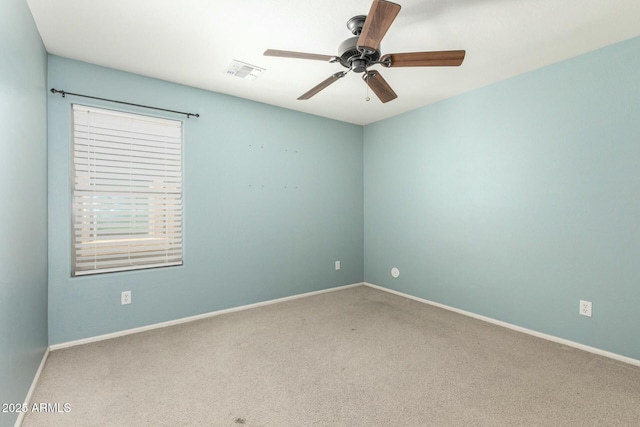 1051 E Julie Ave, San Tan Valley, AZ 85140 - spare room featuring visible vents, baseboards, a ceiling fan, and carpet flooring
