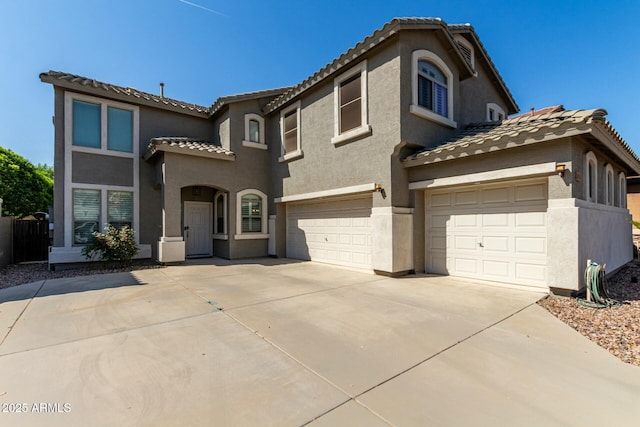1051 E Julie Ave, San Tan Valley, AZ 85140 - mediterranean / spanish home with an attached garage, stucco siding, and a tile roof