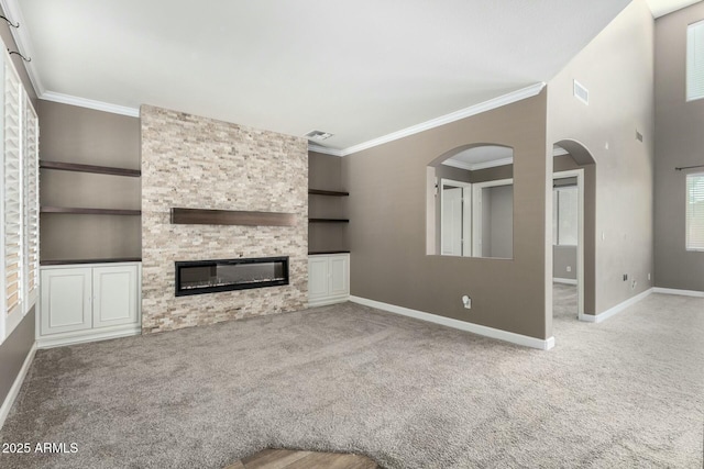 1051 E Julie Ave, San Tan Valley, AZ 85140 - unfurnished living room featuring arched walkways, carpet flooring, and visible vents