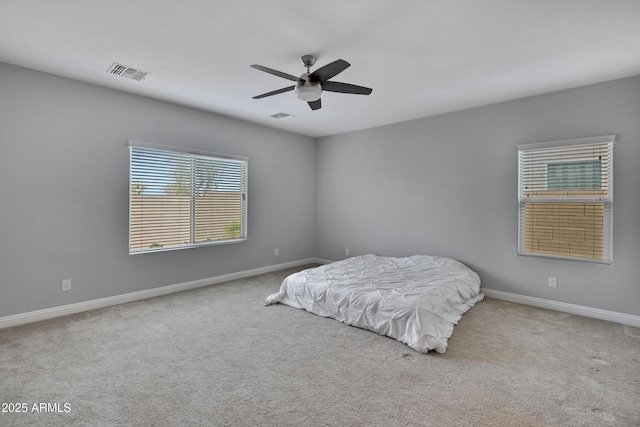 bedroom with baseboards, visible vents, and carpet flooring