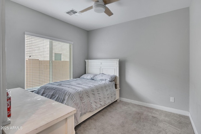 bedroom featuring a ceiling fan, light colored carpet, visible vents, and baseboards