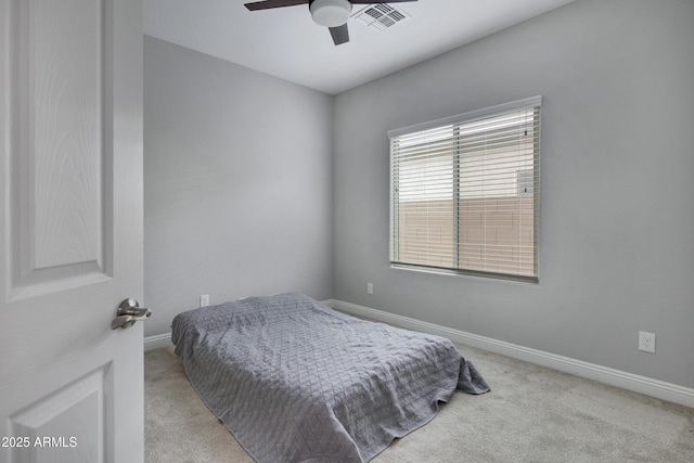 bedroom with visible vents, baseboards, ceiling fan, and carpet flooring